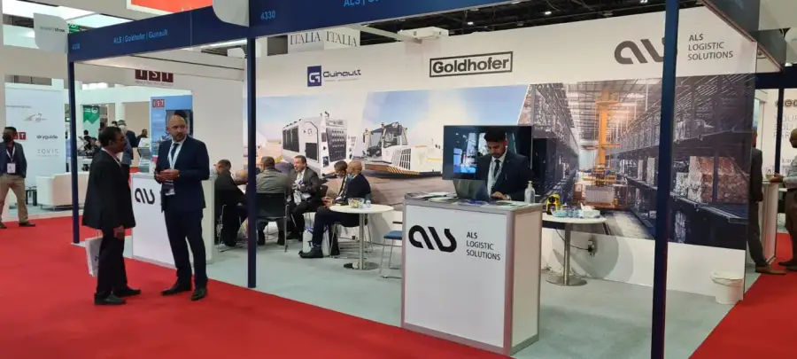 ALS stand with Goldhofer and Guinault branding and visitors in meetings at the Airport Show 2022 in Dubai